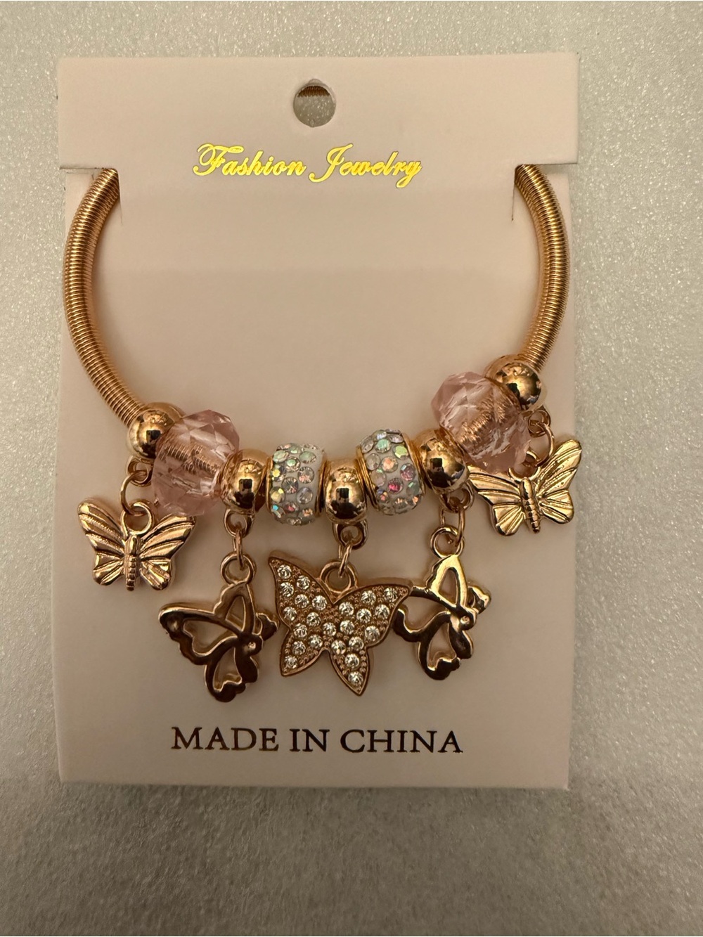 Fashion Jewelry Gold-Tone Bracelet with Pink Accents and Butterfly Charms